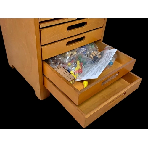 197 - A games chest with contents. 35.5 x 33 x 47cm.