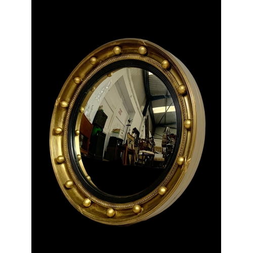 200 - A vintage Regency style convex mirror. 46.5cm