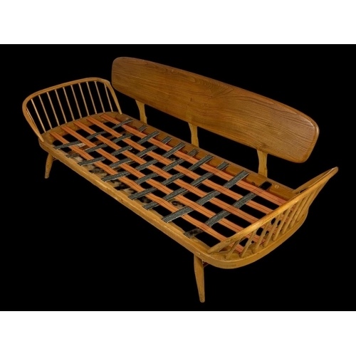 830 - An Ercol Blonde elm model number 355 Studio Daybed Sofa. Mid century. Circa 1960. 209cm.