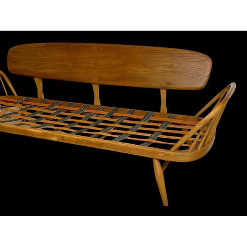 830 - An Ercol Blonde elm model number 355 Studio Daybed Sofa. Mid century. Circa 1960. 209cm.