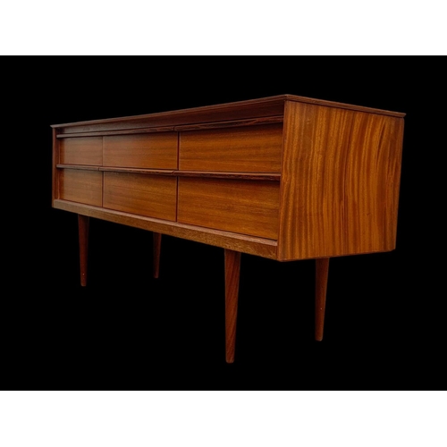 838 - A teak 4 drawer sideboard by Austinsuite. Mid century. Circa 1960’s. 145.5 x 43 x 66cm.