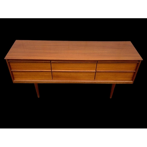 838 - A teak 4 drawer sideboard by Austinsuite. Mid century. Circa 1960’s. 145.5 x 43 x 66cm.