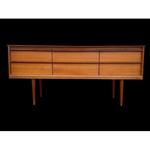 838 - A teak 4 drawer sideboard by Austinsuite. Mid century. Circa 1960’s. 145.5 x 43 x 66cm.