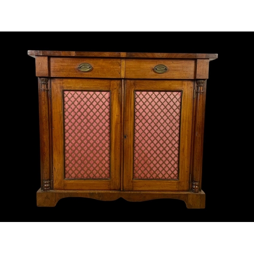 893 - A mid Victorian mahogany chiffonier cabinet with 2 drawers and bras mesh cupboard doors. Circa 1860.... 