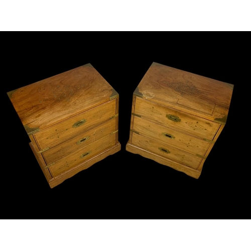 894 - A pair of rosewood campaign style brass inlaid 3 drawer bedsides. 49 x 33 x 50.5cm