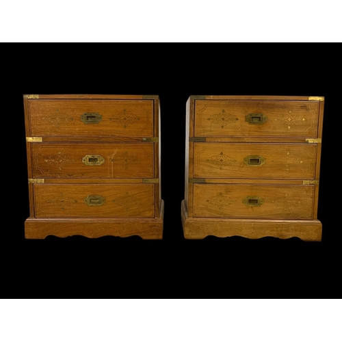 894 - A pair of rosewood campaign style brass inlaid 3 drawer bedsides. 49 x 33 x 50.5cm