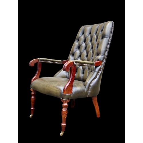 897 - A William IV style deep button leather armchair. 65 x 85 x 104cm.