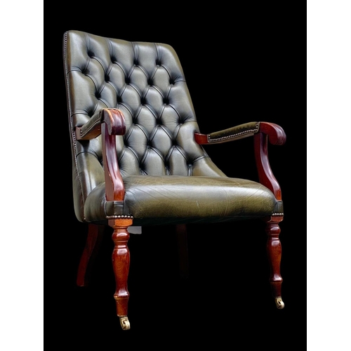 897 - A William IV style deep button leather armchair. 65 x 85 x 104cm.