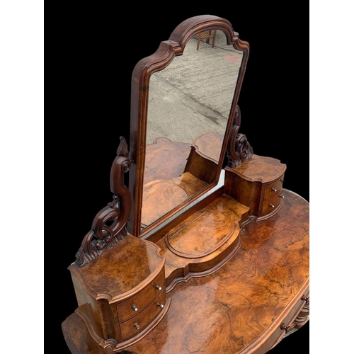 898 - A Victorian burr walnut Duchess dressing table. Circa 1870. 136 x 58 x 166cm