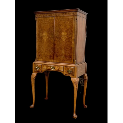 904 - An early Georgian style burr walnut cocktail cabinet, with 3 drawers and glass interior shelves. Cir... 