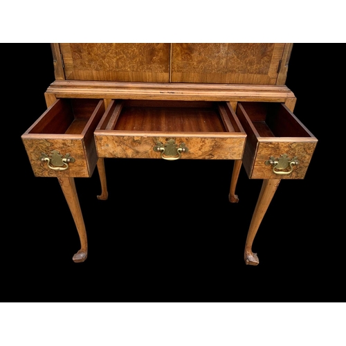 904 - An early Georgian style burr walnut cocktail cabinet, with 3 drawers and glass interior shelves. Cir... 