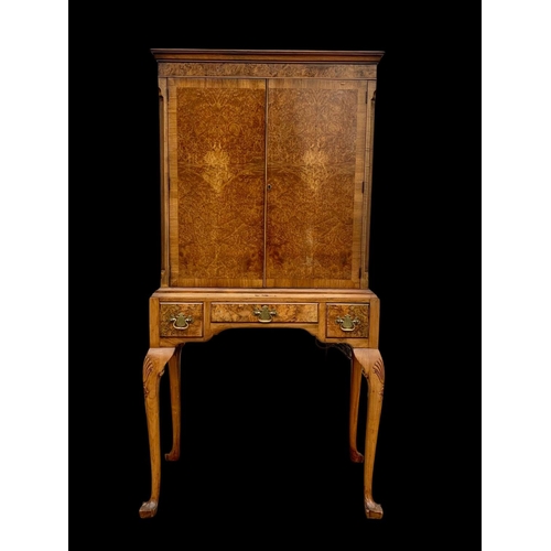 904 - An early Georgian style burr walnut cocktail cabinet, with 3 drawers and glass interior shelves. Cir... 