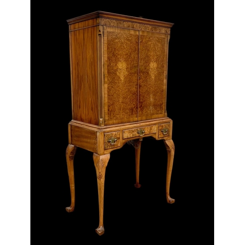 904 - An early Georgian style burr walnut cocktail cabinet, with 3 drawers and glass interior shelves. Cir... 