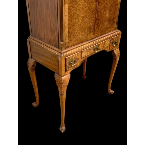 904 - An early Georgian style burr walnut cocktail cabinet, with 3 drawers and glass interior shelves. Cir... 