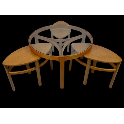 942 - A Nathan teak “Trinity” coffee table, with 3 side tables. 81 x 51cm.