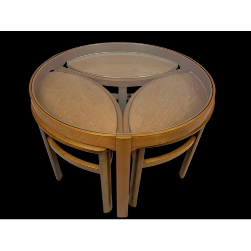 942 - A Nathan teak “Trinity” coffee table, with 3 side tables. 81 x 51cm.