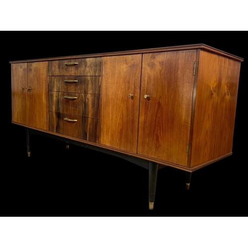 943 - A teak sideboard with 3 drawers and 2 cupboards. Mid century. Circa 1960. 170 x 48.5 x 77.5cm.