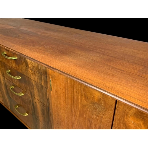 943 - A teak sideboard with 3 drawers and 2 cupboards. Mid century. Circa 1960. 170 x 48.5 x 77.5cm.