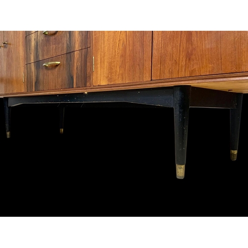 943 - A teak sideboard with 3 drawers and 2 cupboards. Mid century. Circa 1960. 170 x 48.5 x 77.5cm.