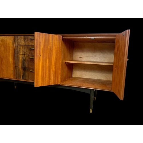 943 - A teak sideboard with 3 drawers and 2 cupboards. Mid century. Circa 1960. 170 x 48.5 x 77.5cm.