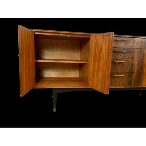 943 - A teak sideboard with 3 drawers and 2 cupboards. Mid century. Circa 1960. 170 x 48.5 x 77.5cm.