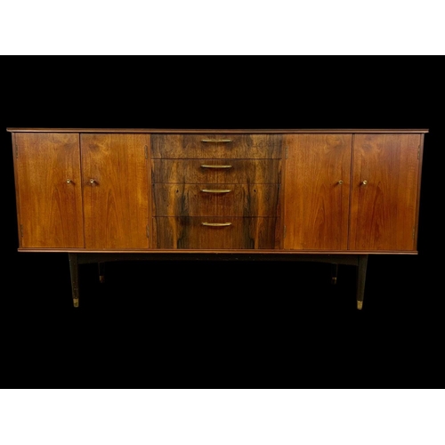 943 - A teak sideboard with 3 drawers and 2 cupboards. Mid century. Circa 1960. 170 x 48.5 x 77.5cm.