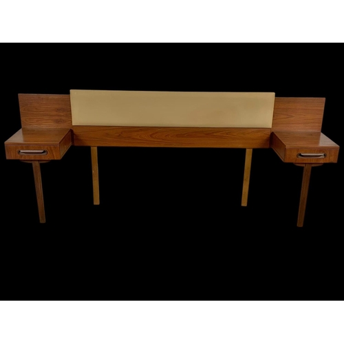 953 - A teak headboard with 2 attached bedsides and leather back board. Mid century. Circa 1970. 220cm.