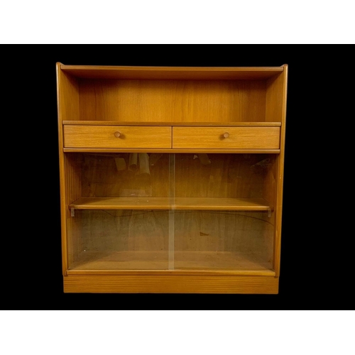 958 - A Nathan Furniture teak 2 drawer bookcase. Mid century. Circa 1970. 102 x 31 x 107cm.