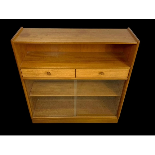 958 - A Nathan Furniture teak 2 drawer bookcase. Mid century. Circa 1970. 102 x 31 x 107cm.