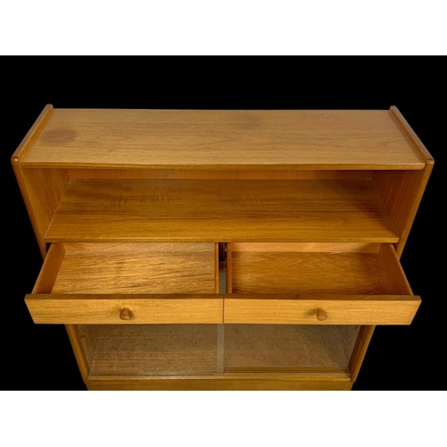 958 - A Nathan Furniture teak 2 drawer bookcase. Mid century. Circa 1970. 102 x 31 x 107cm.