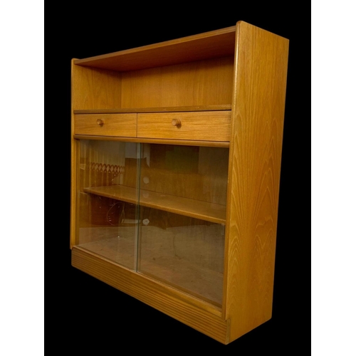 958 - A Nathan Furniture teak 2 drawer bookcase. Mid century. Circa 1970. 102 x 31 x 107cm.