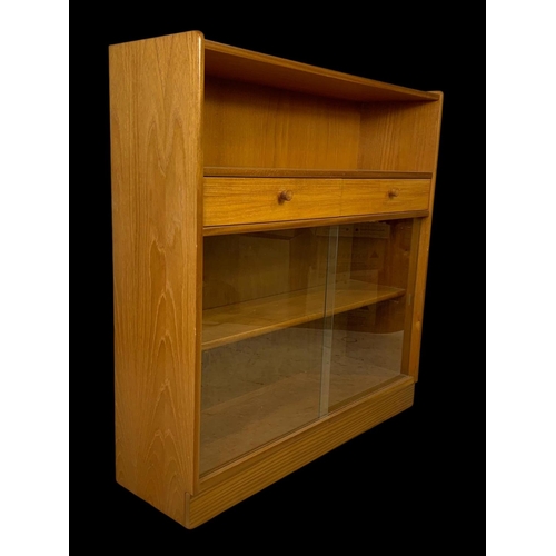 958 - A Nathan Furniture teak 2 drawer bookcase. Mid century. Circa 1970. 102 x 31 x 107cm.