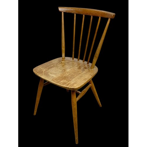 831 - An Ercol Blonde Elm Model 737 chair. Mid century. Circa 1960.