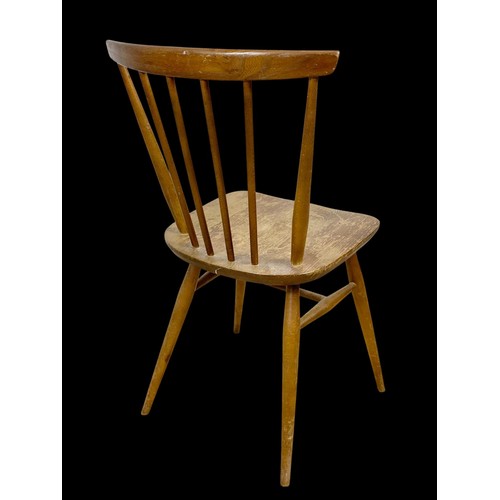 831 - An Ercol Blonde Elm Model 737 chair. Mid century. Circa 1960.