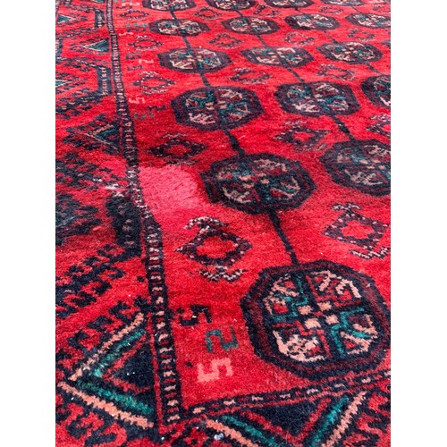 923 - A large vintage Middle Eastern hand knotted rug. 212 x 314cm.