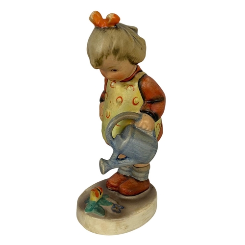 594 - M. J. Hummel Goebel pottery figure “Little Gardener” number 76. 11cm.