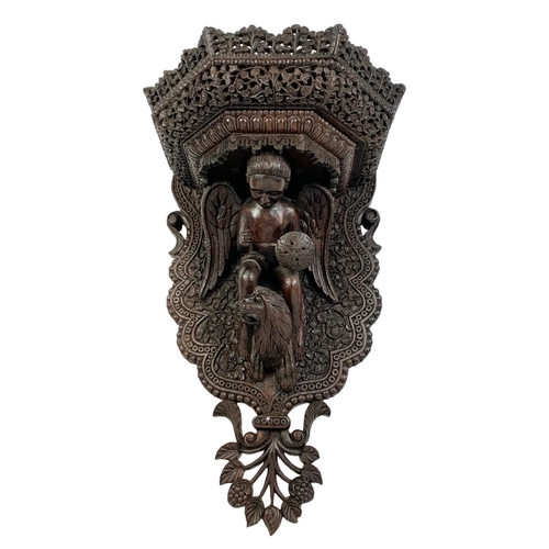 314 - A large late 19th century carved padauk wood wall bracket. Circa 1880. 34 x 57cm