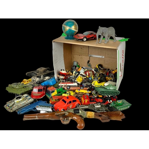 145 - A box of vintage toys/model cars and soldiers. Including tinplate tanks, Dinky, Corgi, Matchbox, pla... 