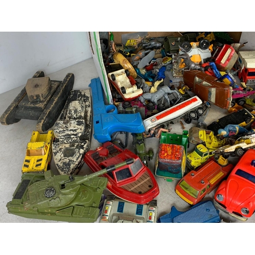 145 - A box of vintage toys/model cars and soldiers. Including tinplate tanks, Dinky, Corgi, Matchbox, pla... 