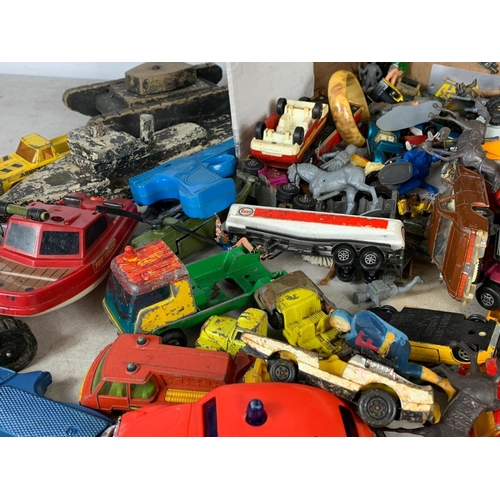 145 - A box of vintage toys/model cars and soldiers. Including tinplate tanks, Dinky, Corgi, Matchbox, pla... 