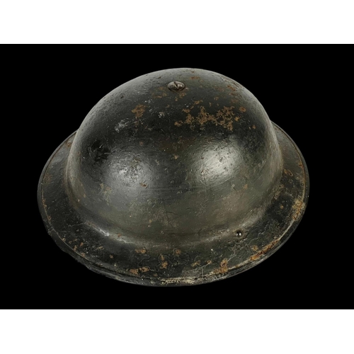 164 - A British military helmet. WWII