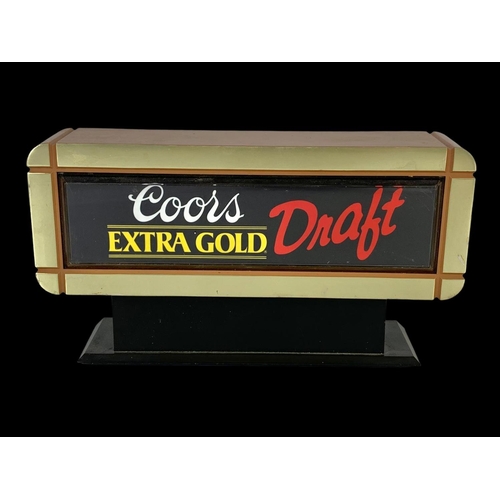 171 - A Coors Extra Gold Draft light up sign. 25 x 14cm.