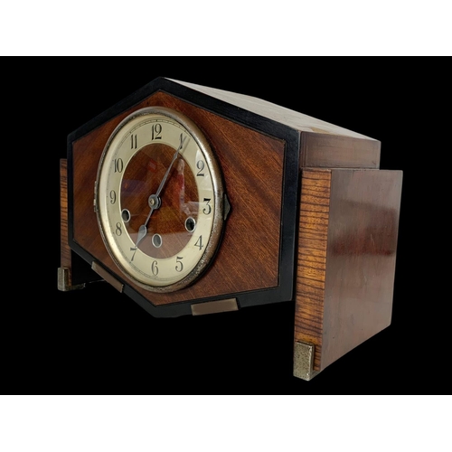 247 - A vintage mantle clock with key and pendulum. 33 x 16 x 22cm.