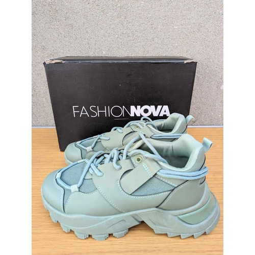 256 - A pair of Fashion Nova womens trainers with a pair of Adidas sliders