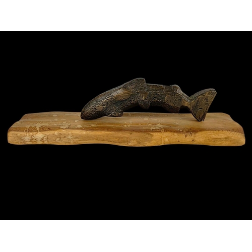 303 - A bronzed fish on a wooden base. 56.5cm.