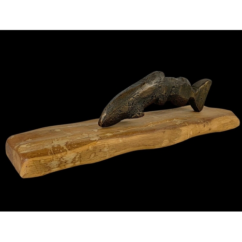 303 - A bronzed fish on a wooden base. 56.5cm.