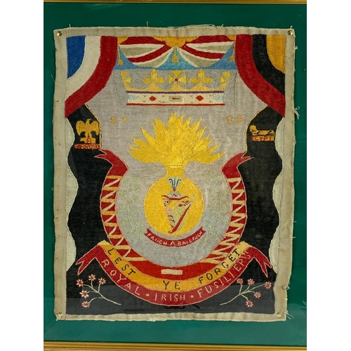 310 - A large WWI Royal Irish Fusiliers embroidery “Lest Ye Forget” frame measures 84.5 x 84.5cm