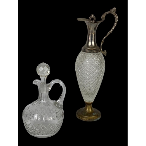 603 - 5 crystal and silver plated decanters and pitchers. Largest 39cm