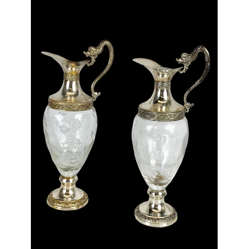 603 - 5 crystal and silver plated decanters and pitchers. Largest 39cm