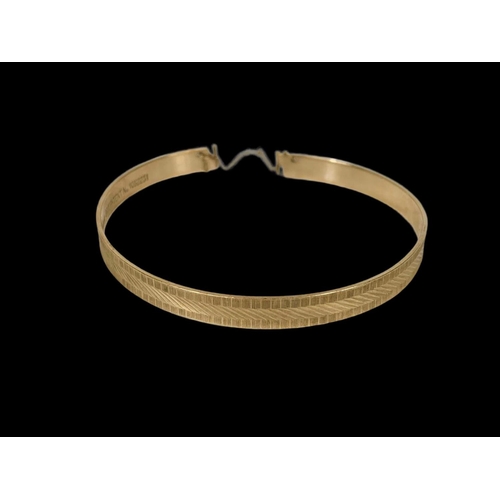 680 - A 9ct gold bangle. 10.91 grams.